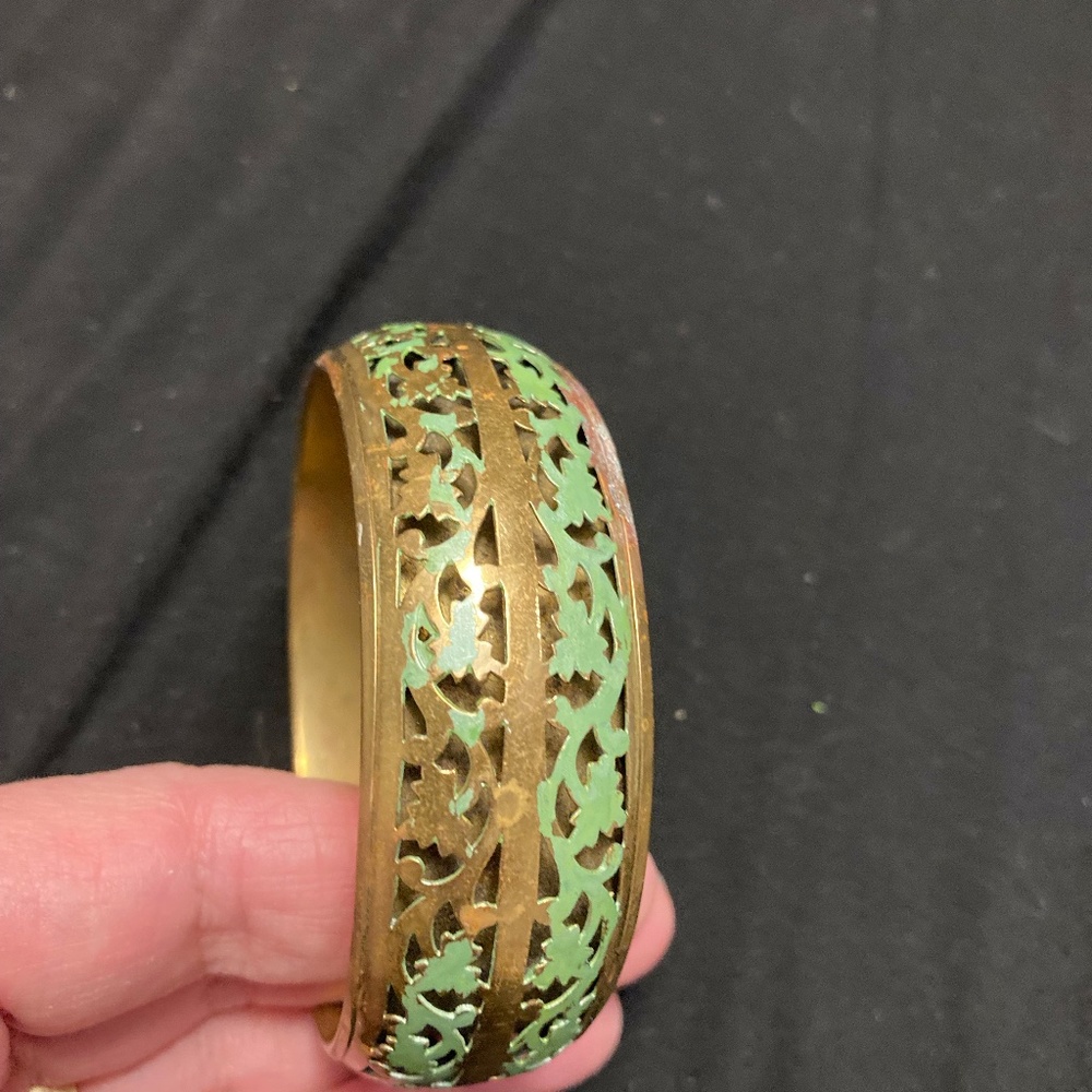 Gold metal and green filagree design, 8 1/4 inch bracelet.